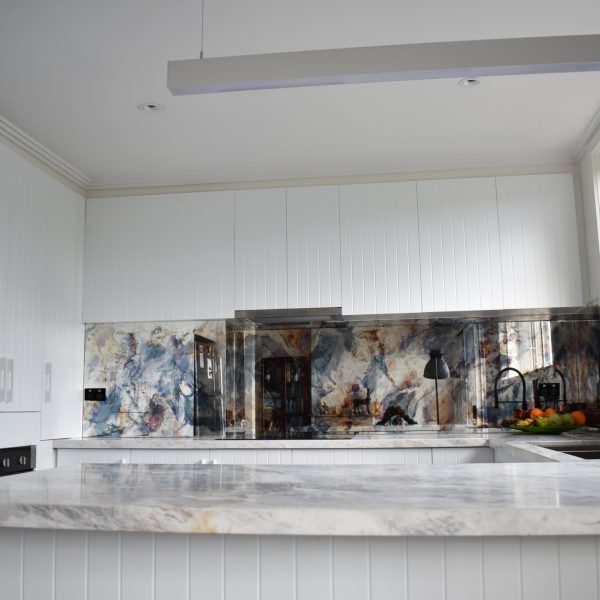 White kitchen with distressed mirror glass splashback