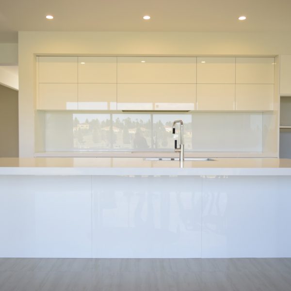 modern Australian kitchen with white glass splashback
