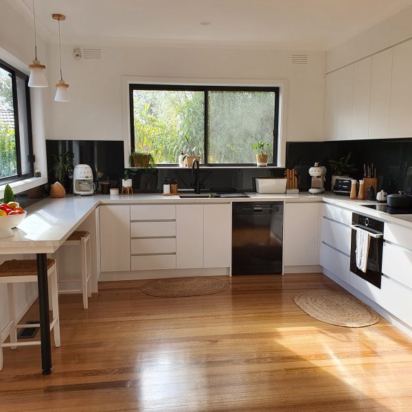 black kitchen splashback contrast with white cupboards