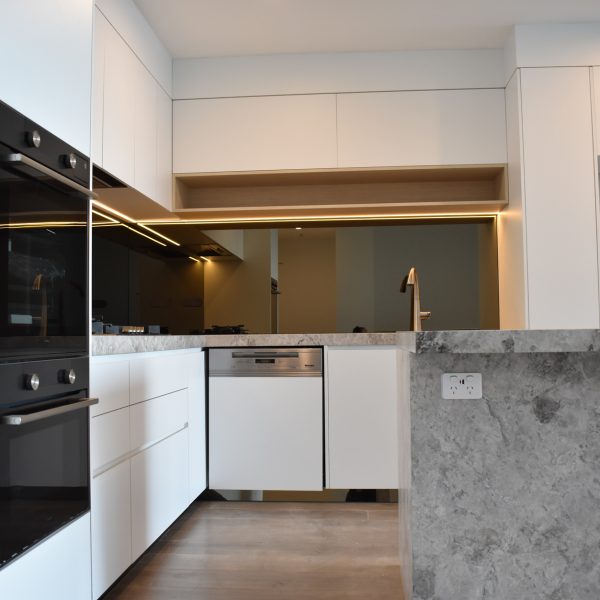 modern kitchen with bronze mirror splashback