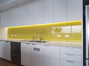 yellow glass splashback in Melbourne kitchen