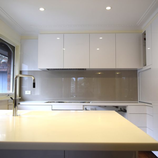grey kitchen splashback against white cupboards